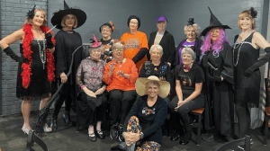 Pictured is Brenda Hayden sitting on the floor; seated left to the right are Sharyn Lobell, Hazel Estave, Sue Macias, and Christi Cashio.  Standing left to the right are Sue Burch, Ann Hingle, Jean Stafford, Linda Corkern, Dot Cashio, Frances Schilling, Lorell Morris, Queen Mother, and Brenda Penny.